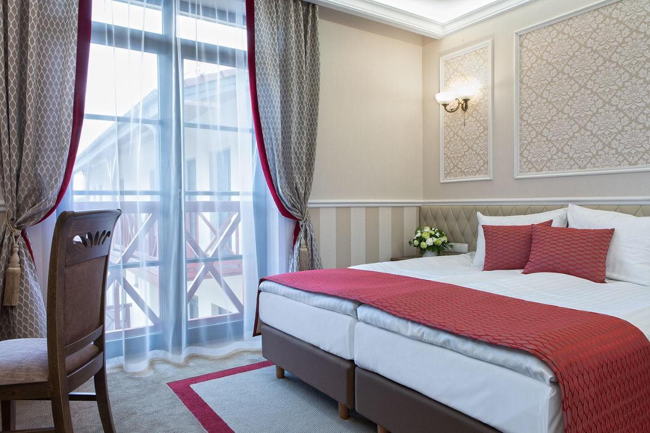 Boutique Odyseja & Spa Ciechocinek Exterior foto A room at the hotel